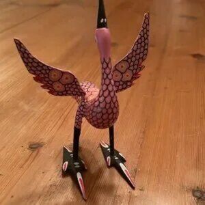 Pink wood carved bird imported from Latin America signed by Ana Oac